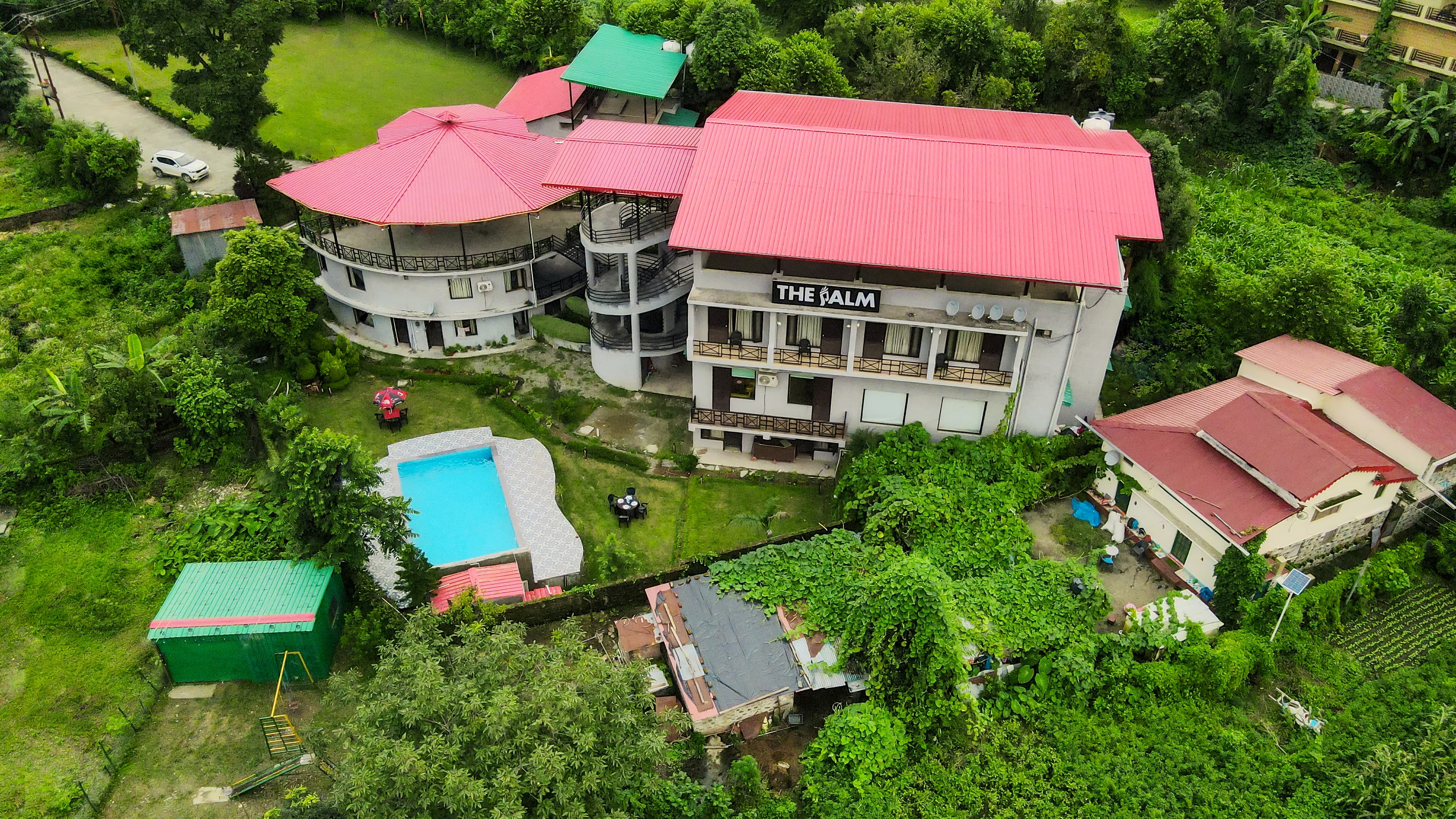 Aerial view of the resort buildings and swimming pool