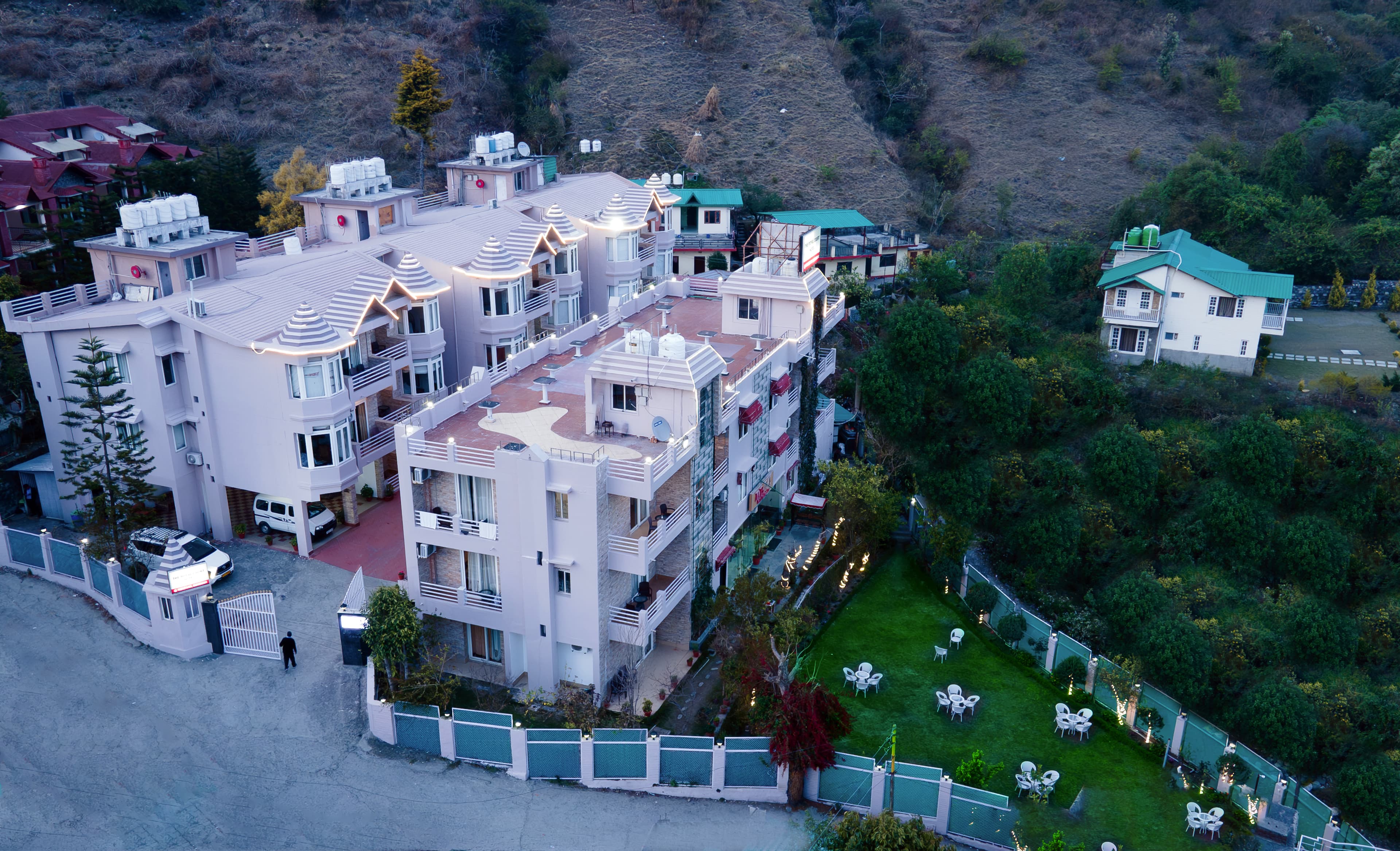 Elevated daytime view of The Royal Court buildings and surrounding hills